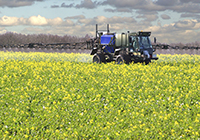 Agriculture crop sprayer in field